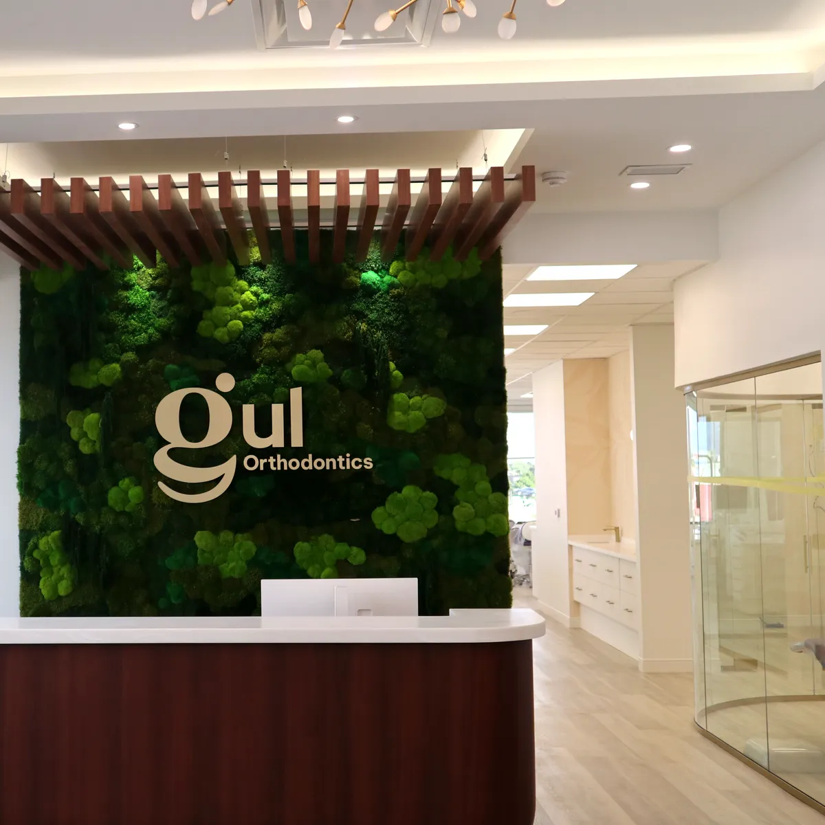 The Gul Orthodontics reception with its living moss wall in Pickering